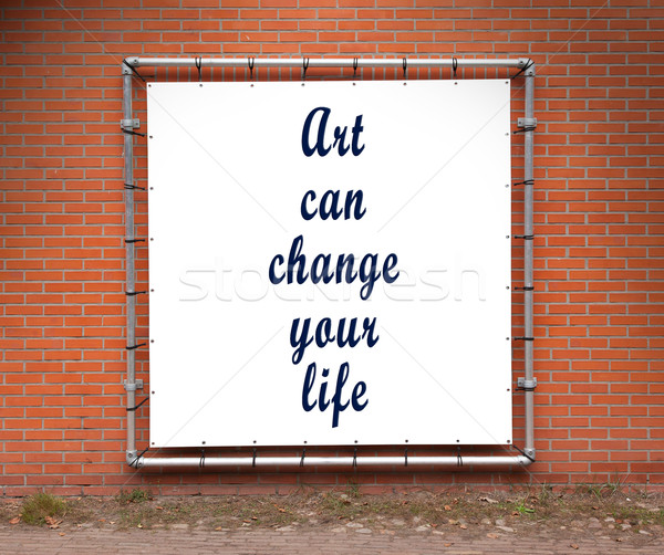 Large banner with inspirational quote on a brick wall Stock photo © michaklootwijk