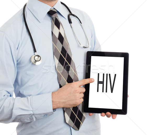 Doctor holding tablet - HIV Stock photo © michaklootwijk