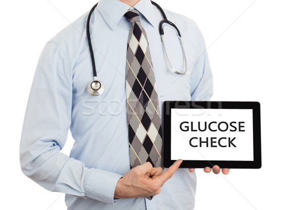 Doctor holding tablet - Glucose check Stock photo © michaklootwijk
