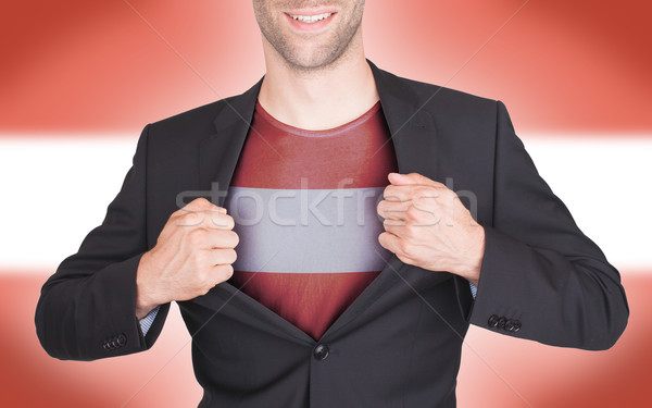 Stock photo: Businessman opening suit to reveal shirt with flag