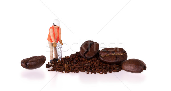 Miniature worker working on a coffee bean Stock photo © michaklootwijk