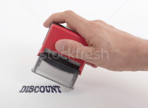 Plastic stamp in hand, isolated Stock photo © michaklootwijk