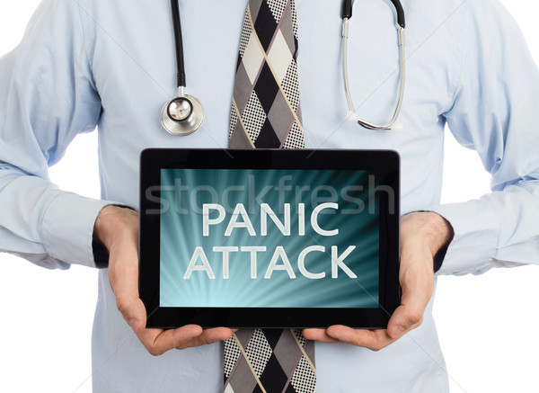 Doctor holding tablet - Panic attack Stock photo © michaklootwijk