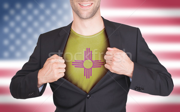 Businessman opening suit to reveal shirt with state flag Stock photo © michaklootwijk