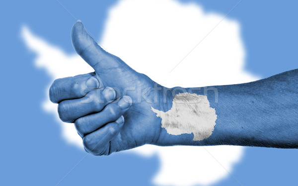 Old woman with arthritis giving the thumbs up sign Stock photo © michaklootwijk