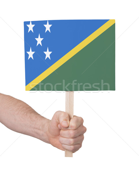 Hand holding small card - Flag of Solomon Islands Stock photo © michaklootwijk