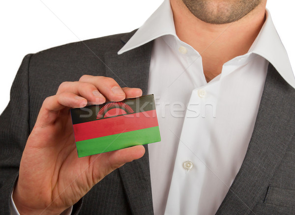 Businessman is holding a business card, bol, visiting, white, wo Stock photo © michaklootwijk