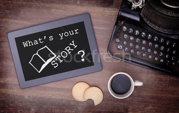 Stock photo: Tablet touch computer gadget on wooden table, what's your story