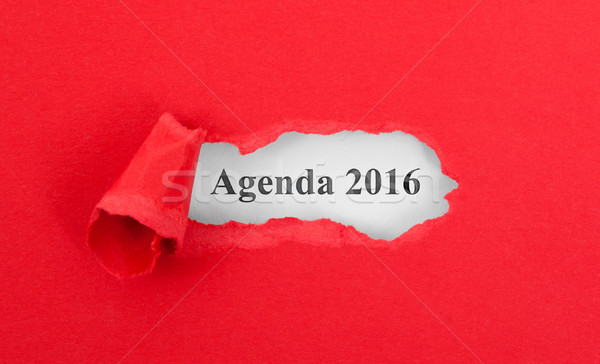Stock photo: Text appearing behind torn red envelop