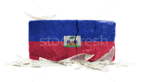 Ladrillo vidrios rotos violencia bandera Haití pared Foto stock © michaklootwijk