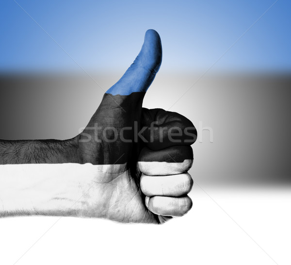 Closeup of male hand showing thumbs up sign Stock photo © michaklootwijk