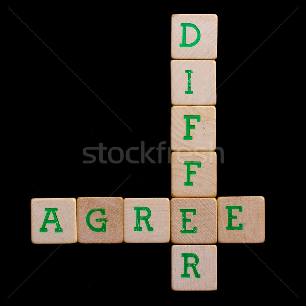 Letters on old wooden blocks (agree, differ) Stock photo © michaklootwijk