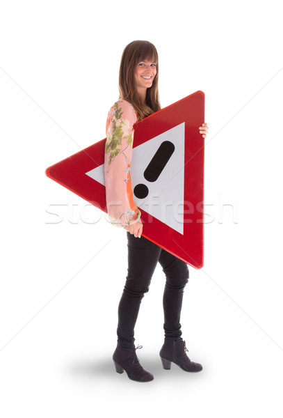 Concept of caution - Woman standing with caution sign Stock photo © michaklootwijk