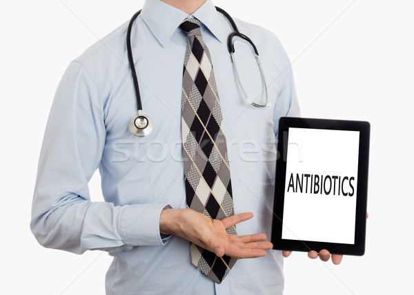 Orvos tart tabletta antibiotikum izolált fehér Stock fotó © michaklootwijk