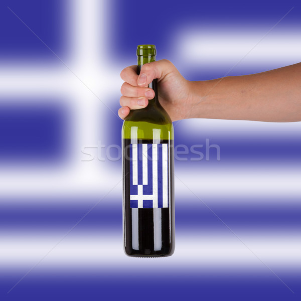 Mano bottiglia vino rosso etichetta Grecia Foto d'archivio © michaklootwijk