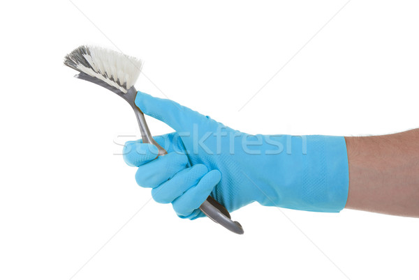 Protection glove holding a dish-brush Stock photo © michaklootwijk