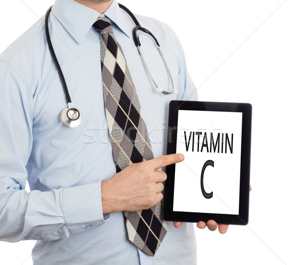 Arzt halten Tablet vitamin c isoliert weiß Stock foto © michaklootwijk