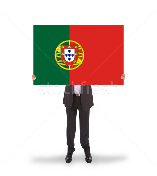 Stock photo: Smiling businessman holding a big card, flag of Portugal