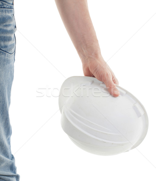 Male engineer in jeans holding white hardhat Stock photo © michaklootwijk