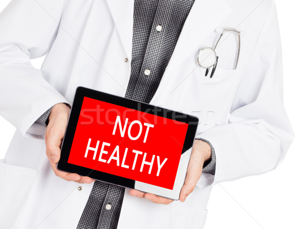 Doctor holding tablet - Not healthy Stock photo © michaklootwijk