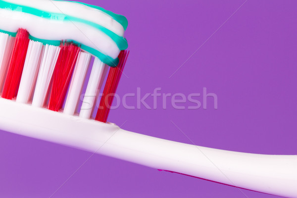 A pink toothbrush with toothpaste Stock photo © michaklootwijk