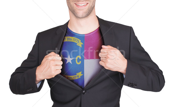 Businessman opening suit to reveal shirt with state flag Stock photo © michaklootwijk