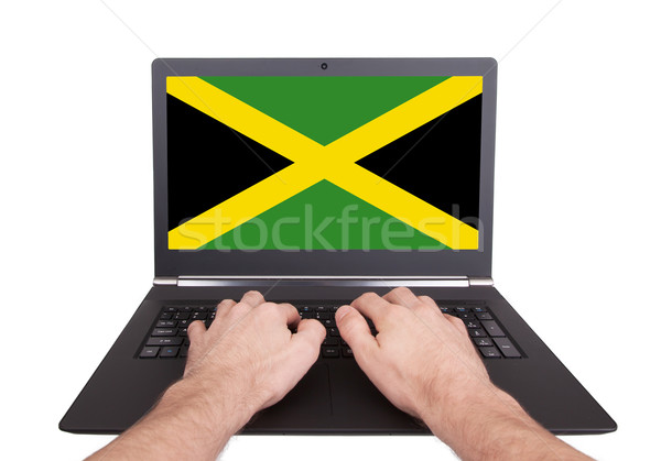 Kezek dolgozik laptop Jamaica mutat képernyő Stock fotó © michaklootwijk