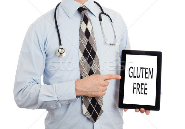 Doctor holding tablet - Gluten free Stock photo © michaklootwijk