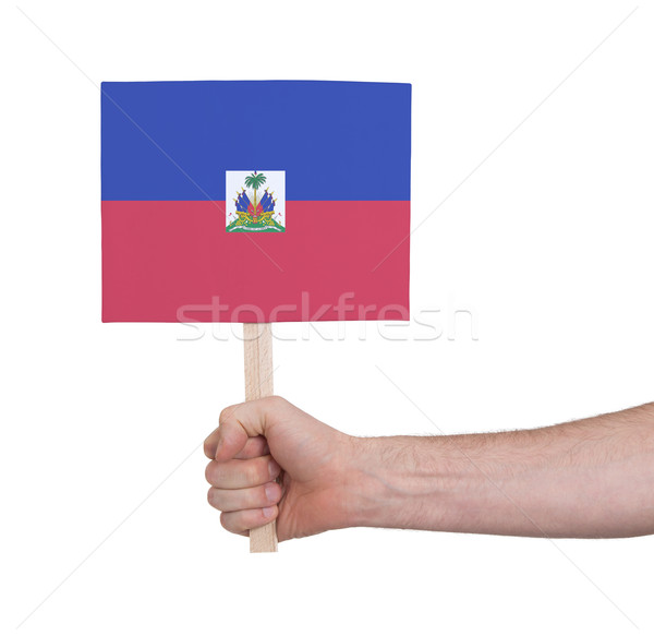 Hand holding small card - Flag of Haiti Stock photo © michaklootwijk