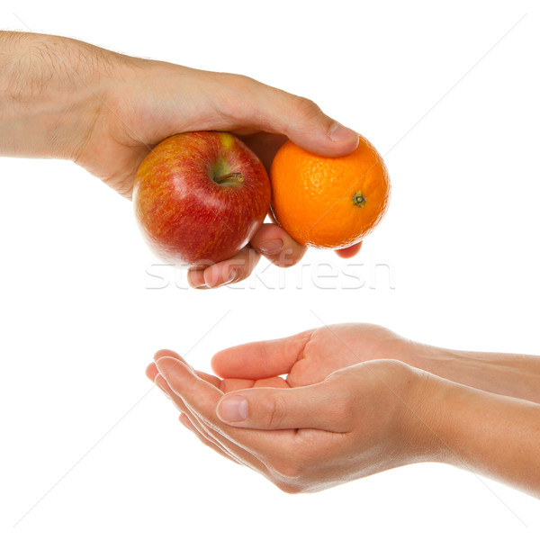 Stock photo: Giving an apple and an orange