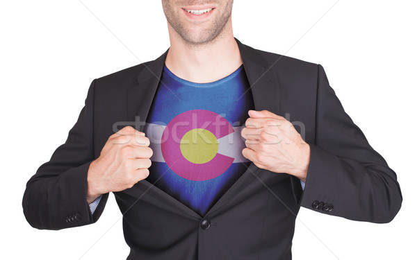 Businessman opening suit to reveal shirt with state flag Stock photo © michaklootwijk