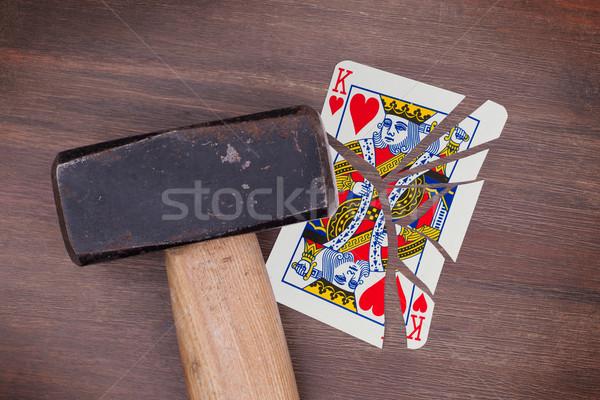 Hammer with a broken card, king of hearts Stock photo © michaklootwijk