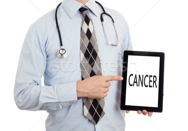 Stock photo: Doctor holding tablet - Cancer