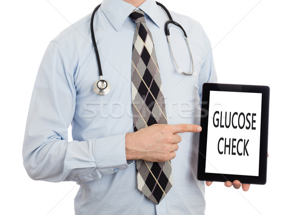 Doctor holding tablet - Glucose check Stock photo © michaklootwijk