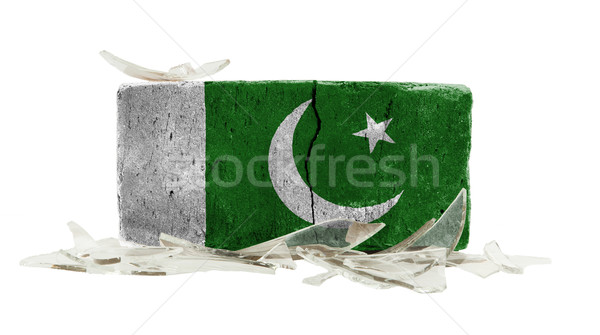 Tijolo cacos de vidro violência bandeira Paquistão parede Foto stock © michaklootwijk
