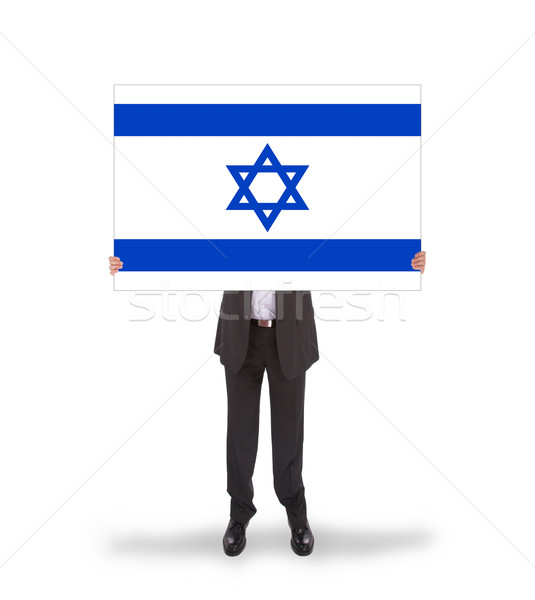 Smiling businessman holding a big card, flag of Israel Stock photo © michaklootwijk