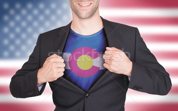 Businessman opening suit to reveal shirt with state flag Stock photo © michaklootwijk