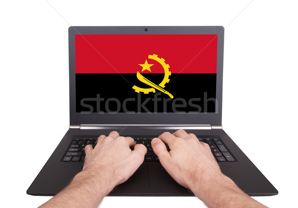 Kezek dolgozik laptop Angola mutat képernyő Stock fotó © michaklootwijk