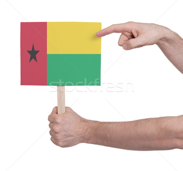 Hand holding small card - Flag of Guinea Bissau Stock photo © michaklootwijk