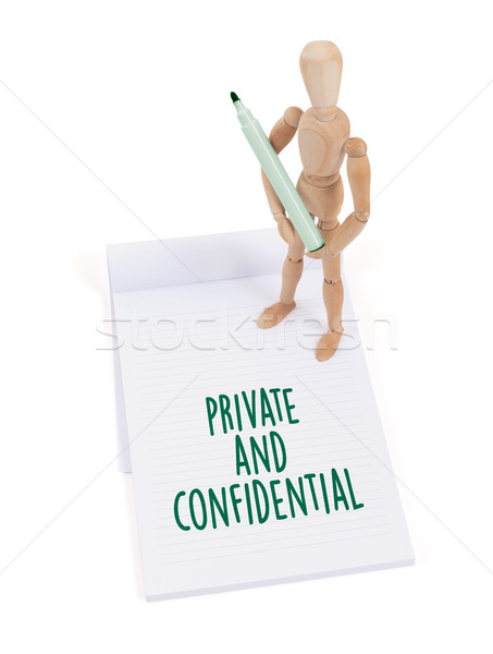 Wooden mannequin writing - Private and confidential Stock photo © michaklootwijk