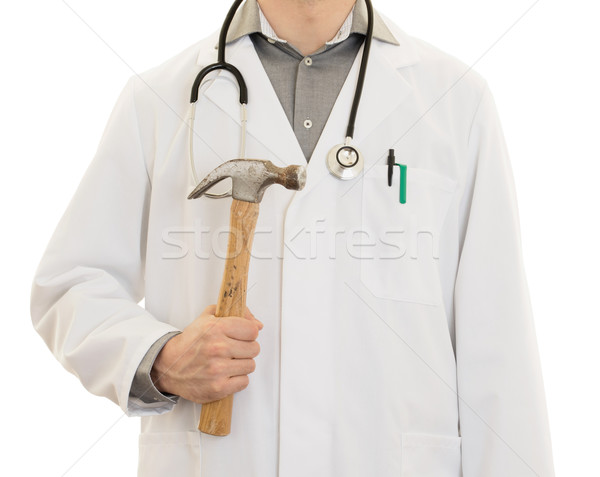 Crazy doctor is holding a big hammer in his hands Stock photo © michaklootwijk