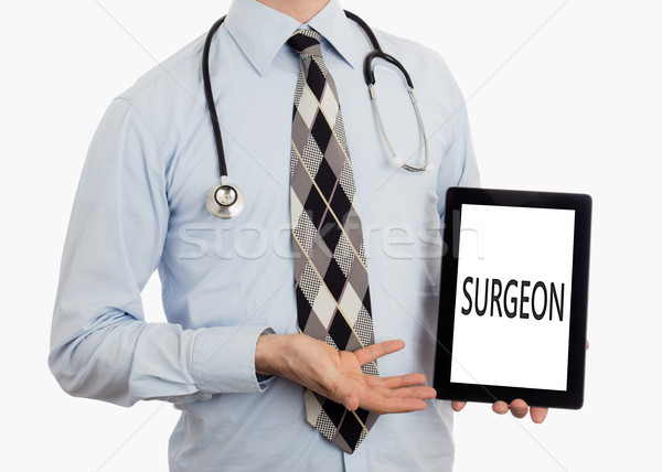 Doctor holding tablet - Surgeon Stock photo © michaklootwijk