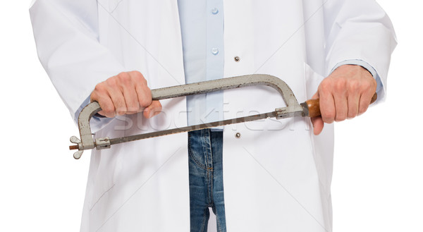 Crazy doctor is holding a big saw in his hands Stock photo © michaklootwijk