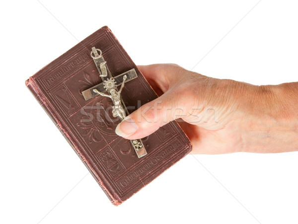 Old hand (woman) holding a very old bible Stock photo © michaklootwijk