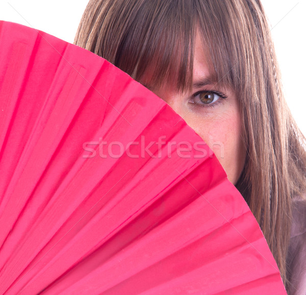 Studio portrait of a womans face partly hidden by a fan Stock photo © michaklootwijk