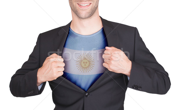 Businessman opening suit to reveal shirt with flag Stock photo © michaklootwijk