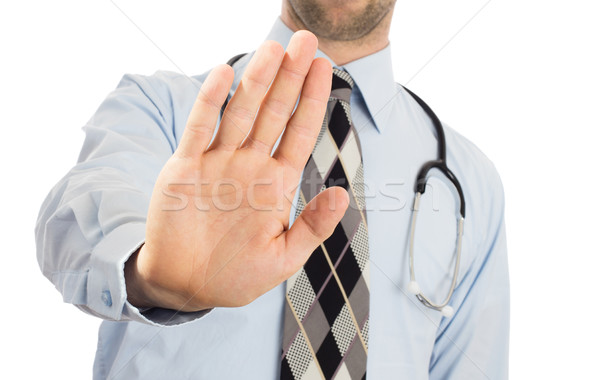 Male doctor holding up his hand in a Halt or Stop gesture Stock photo © michaklootwijk