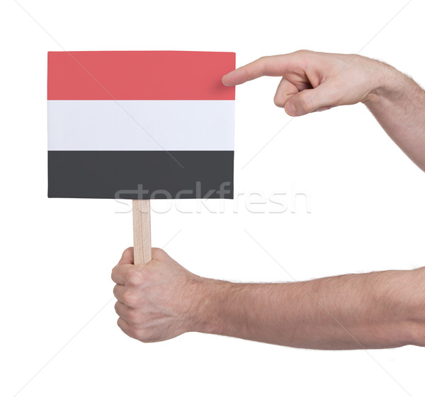 Hand holding small card - Flag of Yemen Stock photo © michaklootwijk