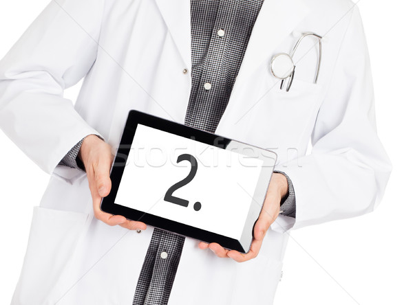 Doctor holding tablet - Number 2 Stock photo © michaklootwijk