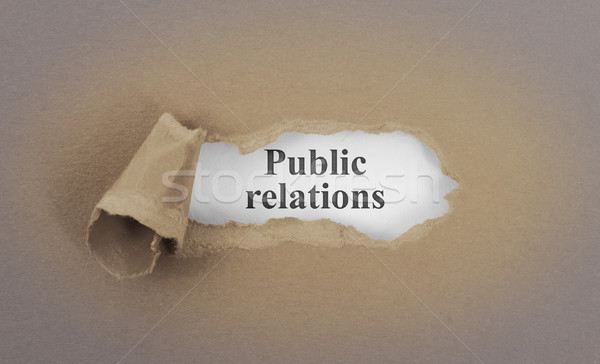 Text appearing behind torn brown envelop Stock photo © michaklootwijk